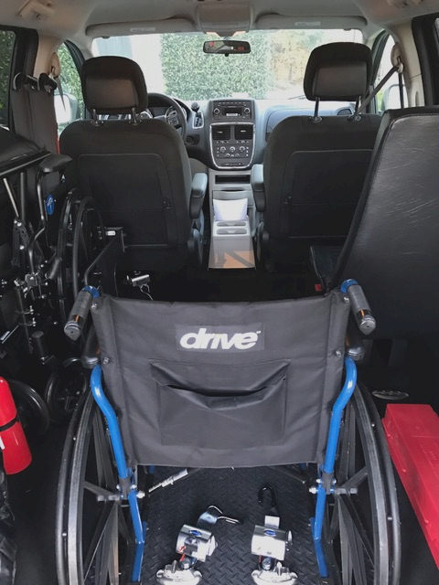 Transport vehicle for wheelchair patients