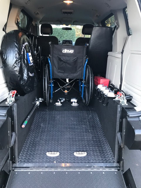 Wheelchair loaded in vehicle for hospital transport