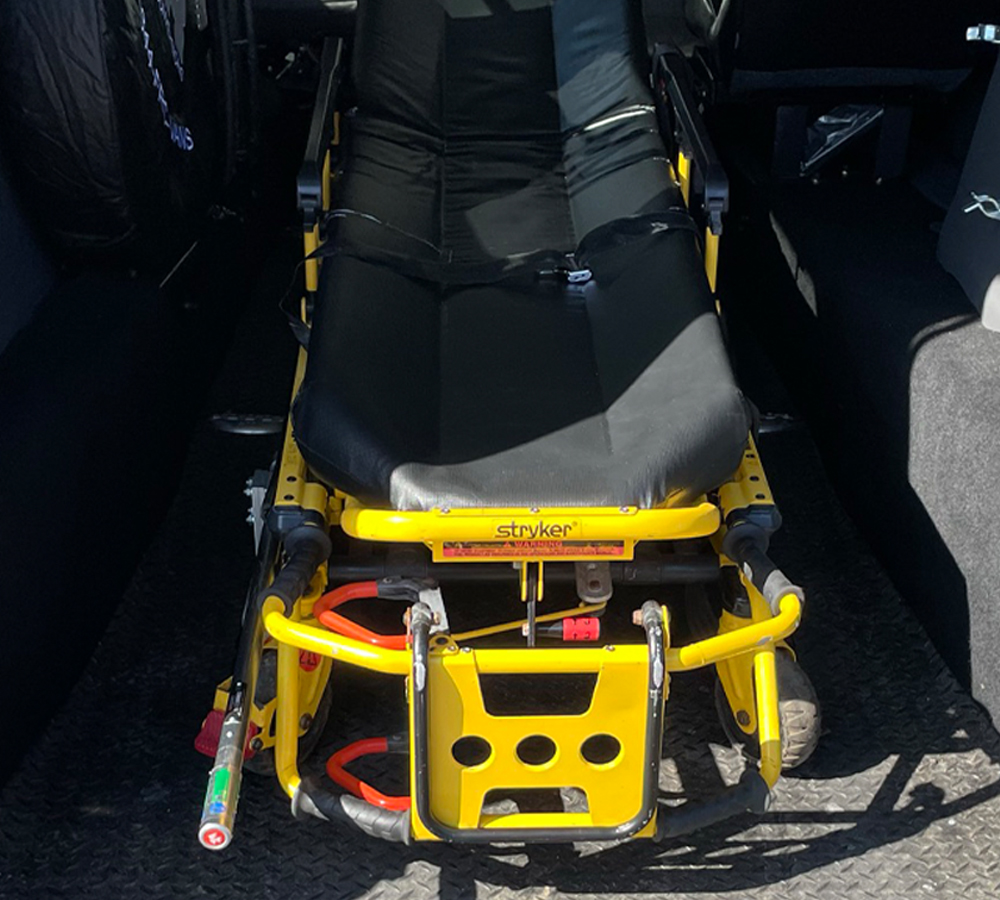 a bariatric stretcher inside a van