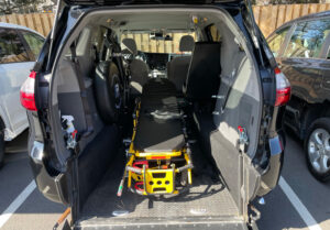 a stretcher inside an H&M Transport van