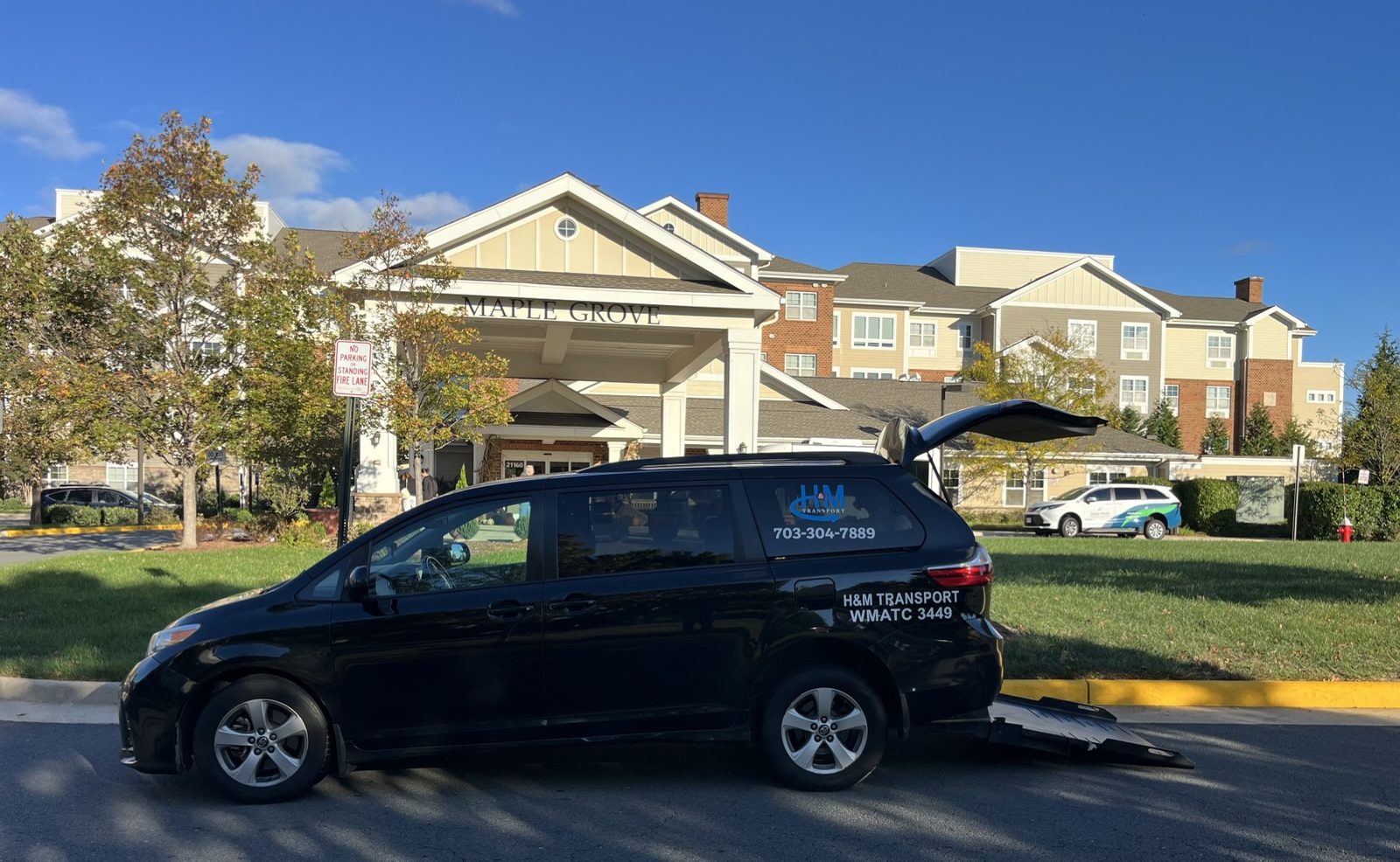 H&M Transport van picking up a resident at Ashby Ponds senior living community in Ashburn, Virginia