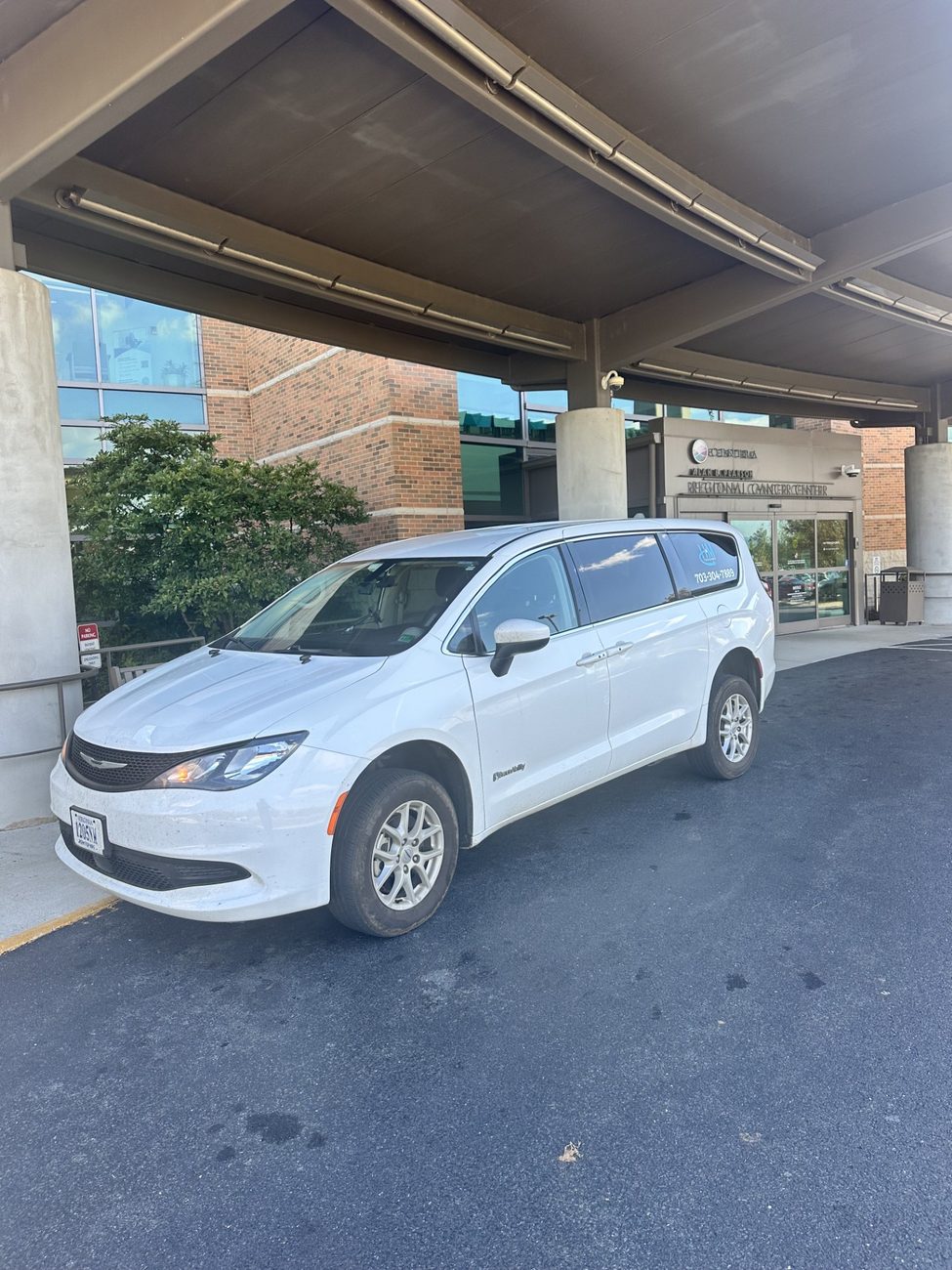 H&M Transport van at a regional cancer center for a scheduled treatment appointment