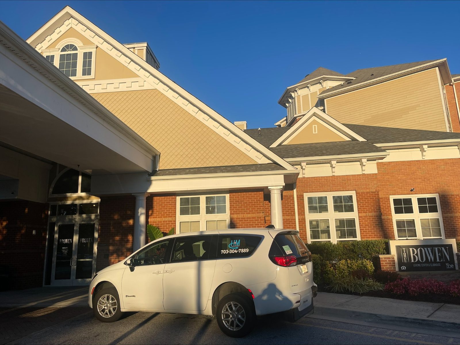 H&M Transport van collecting a resident from a senior living community
